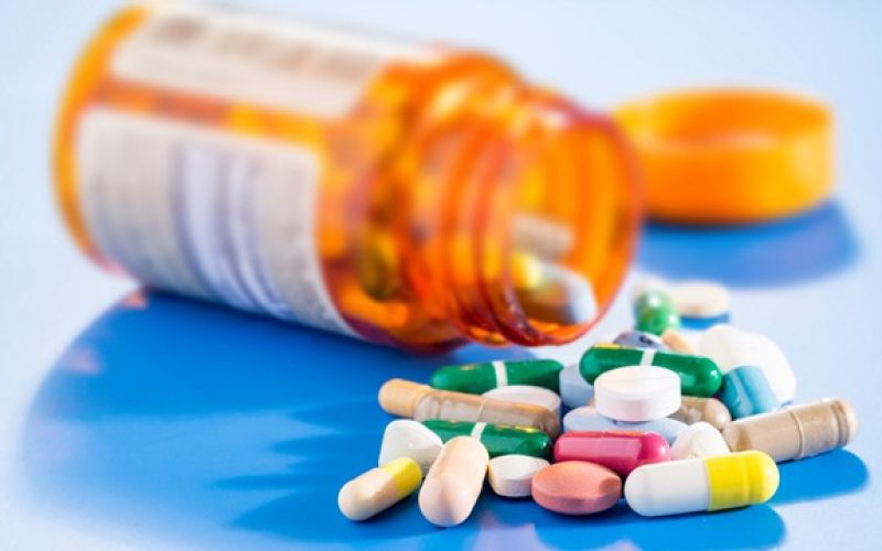 Pills and capsules in medical vial